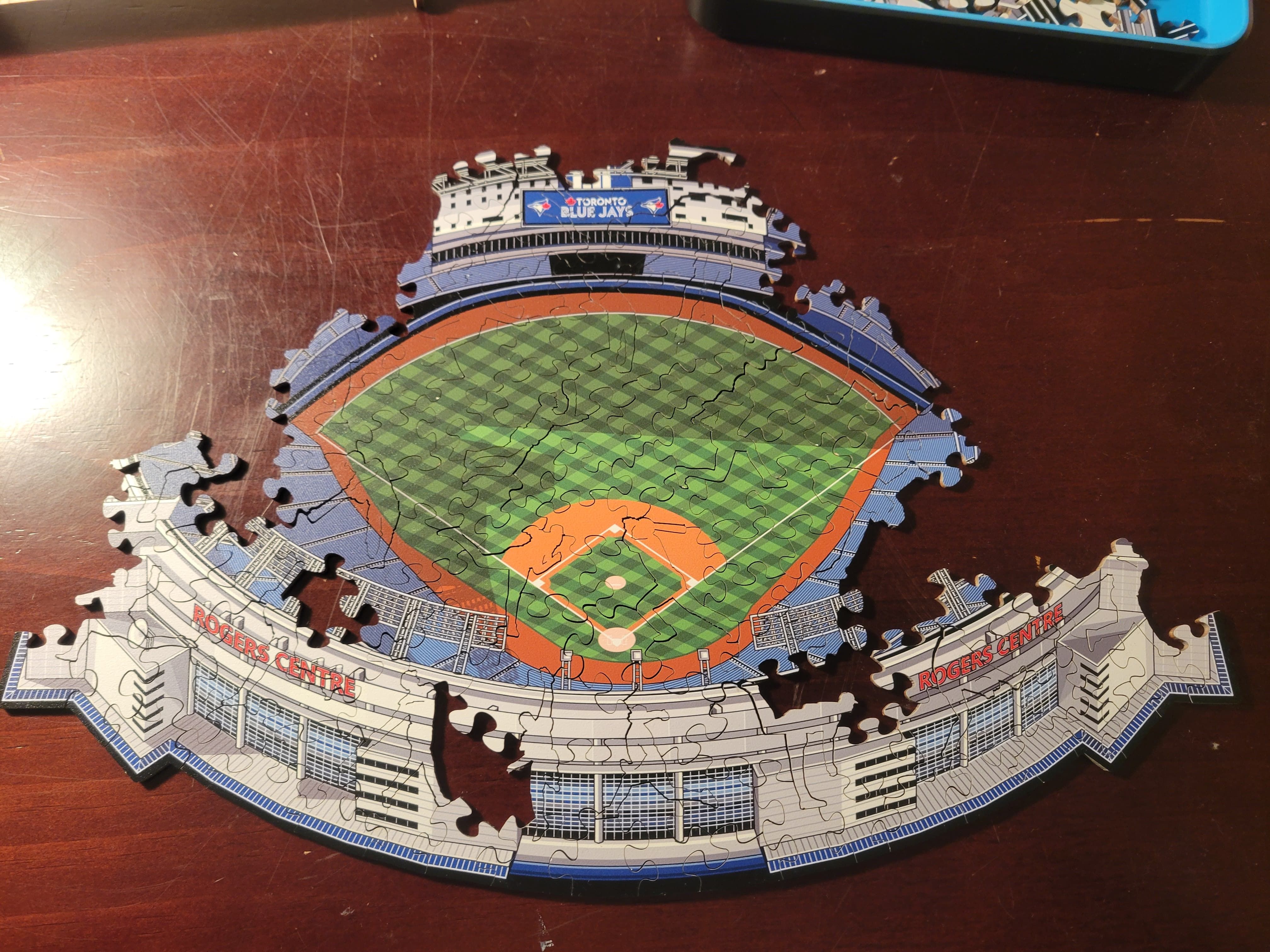 An incomplete artist rendering of The Rogers Centre, home field of the Toronto Blue Jays. It's a puzzle and several pieces are missing.