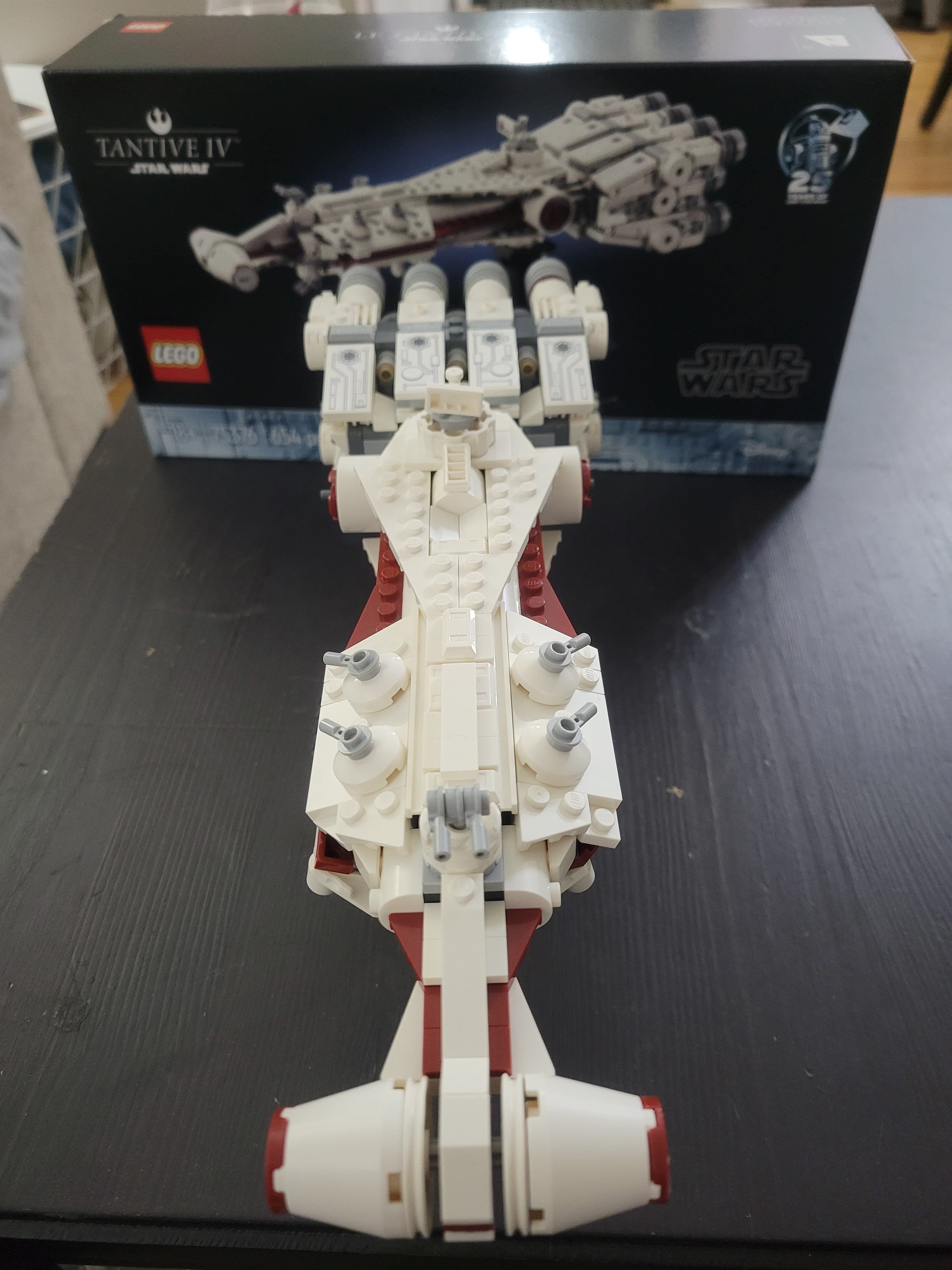 An overhead view of the completed Tantive IV. The front of the ship is at the bottom of the picture, and is in front of the original box.